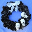 black-news-wreath-skulls-done-240x234